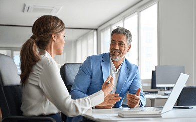 Professional conversation in bright office