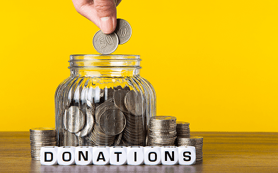Coins in a donations jar