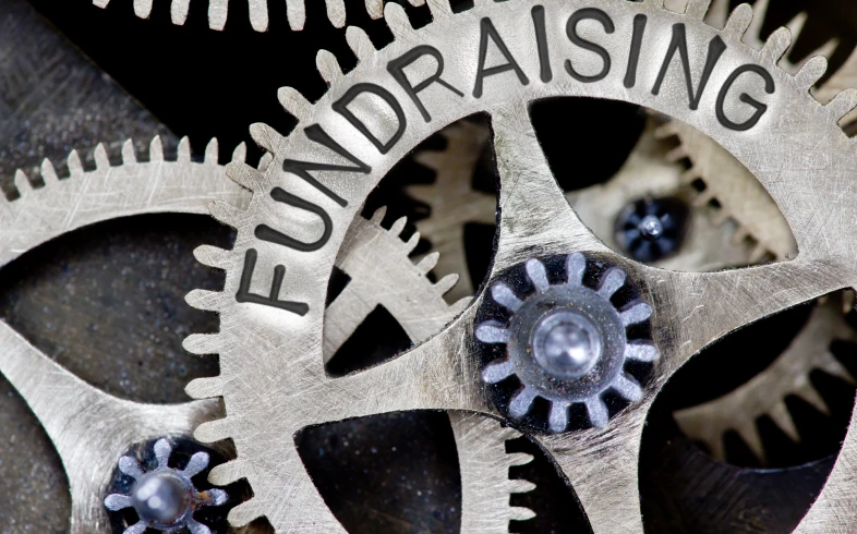 Mechanical gears with fundraising text